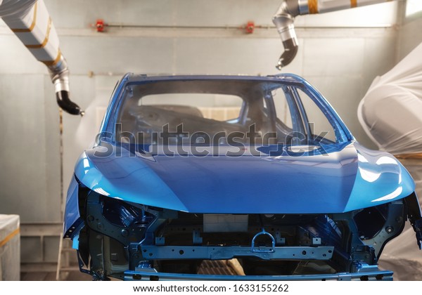 Production line of automobile\
plant, paint shop. The body of the car after applying the\
varnish.