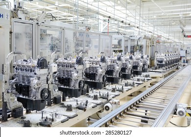 Production line for manufacturing of the engines in the car factory. Car factory. Car parts. Engine factory. New engine factory. Engines on line.