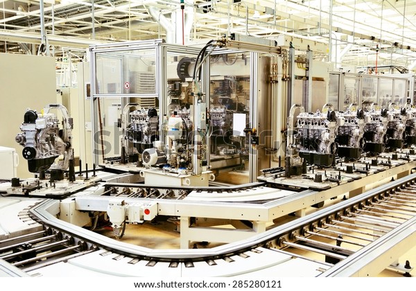 Production line for manufacturing of the engines\
in the car factory.