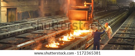 Production of metal components in a foundry - group of workers