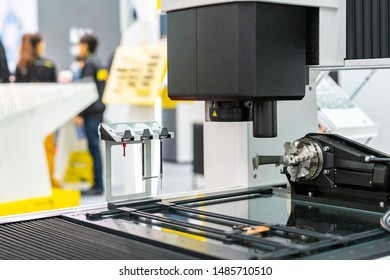 Production Parts Or Sample From Manufacturing Process During Hold By Rotary Chuck On Table Of High Technology & Precision Automatic Measuring Machine For Multi Inspection Dimension Shape Appearance