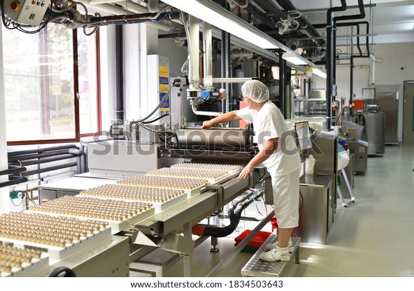 Production\
of pralines in a factory for the food\
industry