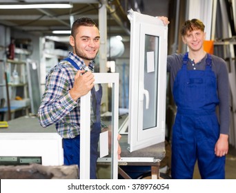 Production smiling workers in coverall with different PVC window 