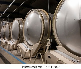 Production of sweet cassis creme liquor from ripe black currant berries, distillation and maceration in steel tanks,  Burgundy, France - Shutterstock ID 2144144077
