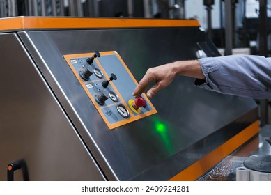 Production switch control panel and switcher, using a lever arm. Man's hand in uniform holds the lever. Mechanic. Production equipment.