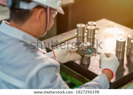 Production worker use outside micrometer inspection high metal product