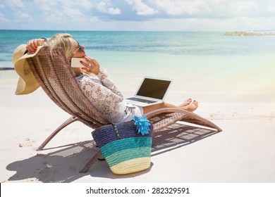 Productive Businesswoman Working On The Beach