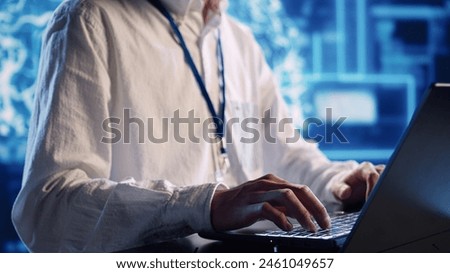 Productive engineer in high tech establishment uses artificial intelligence computing simulating human brain. Tech savvy admin running operations on laptop with AI machine learning algorithms close up