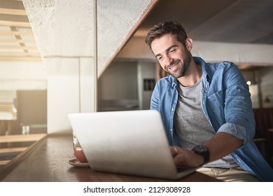 For productivity, just log in. Shot of a handsome young man using a laptop in a coffee shop. - Powered by Shutterstock