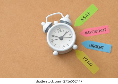 Productivity and Task Prioritization: Small Clock with ASAP, Urgent, Important and To-Do Arrow Markers