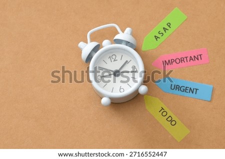 Productivity and Task Prioritization: Small Clock with ASAP, Urgent, Important and To-Do Arrow Markers
