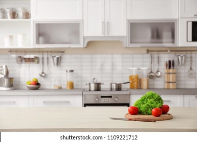 Products and blurred view of kitchen interior on background