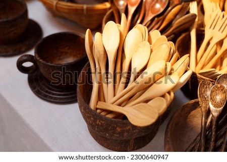 products from coconut shells A variety of designs, including teaspoons, glasses, cups, ladles, which are community products. Soft and selective focus.                               
