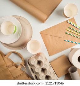 Products Made From Recycled Paper: Disposable Tableware, Package, Box, Cardboard, Egg Packaging, Envelope, Toilet Paper, Kraft Paper. Concept: Environmental Protection, Nature Conservation, Recycle. 