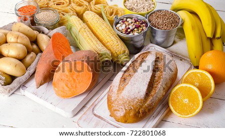 Products rich of carbohydrates. Healthy eating on white wooden table.