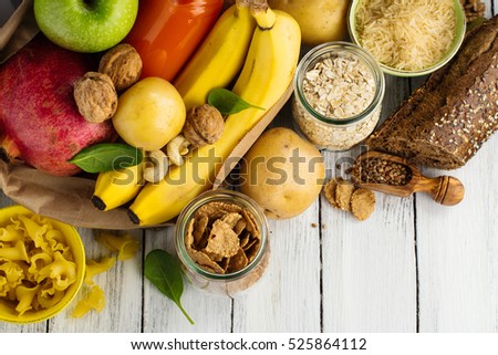 Products rich of complex carbohydrates. Healthy food on wooden background. Space for text