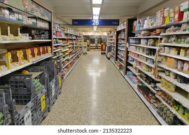 Products are seen on shelves in a Tesco supermarket aisle on December 12, 2014 in London, UK.  Britain's Tesco is the world's third largest supermarket after America's Walmart and France's Carrefour.