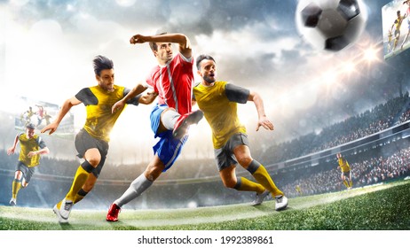 Profeccional soccer players in action on the grand stadium background - Powered by Shutterstock