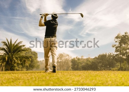 Professinal golf player on golf course. Pro golfer taking a shot. person, golf, golfer, sport, player, golfing