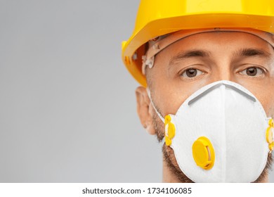 Profession, Construction And Building - Male Worker Or Builder In Helmet And Respirator Mask Over Grey Background