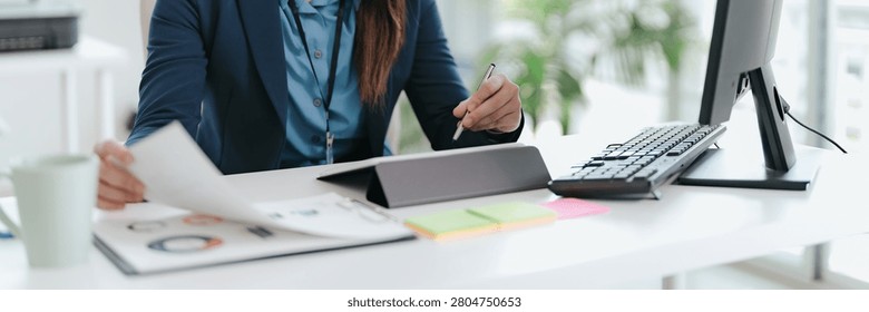 Professional accountant analyzing documents in office for precise valuation
