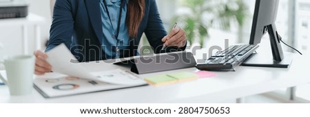 Professional accountant analyzing documents in office for precise valuation