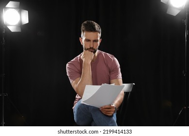 Professional Actor Reading His Script During Rehearsal In Theatre