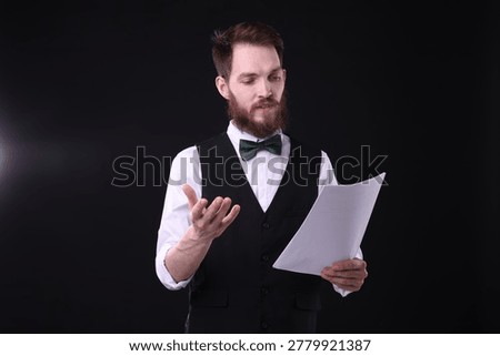 Professional actor with script performing on stage