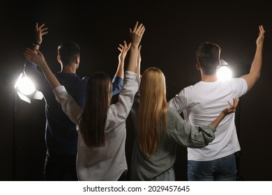 Professional Actors Bowing On Stage In Theatre, Back View