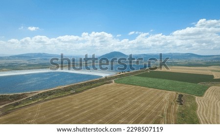 Professional aerial photography of 2 water reservoirs between agricultural areas. A beautiful view of agricultural fields and water reservoirs