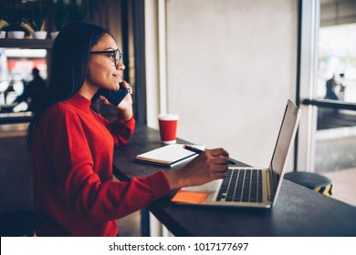 Professional African american copywriter talking about new project on mobile earning money online.Attractive dark skinned manager in stylish spectacles checking banking account talking with operator - Shutterstock ID 1017177697