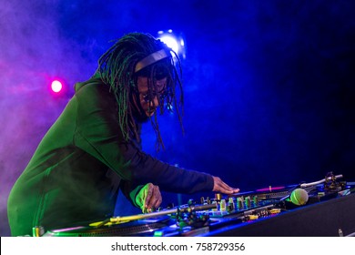 professional african american DJ in headphones with sound mixer in nightclub  - Powered by Shutterstock