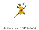 Professional african american football soccer player in motion isolated on white studio background. Fit jumping man in action, jump, movement at game.