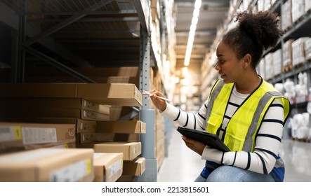 Professional African Female Worker using 
technology.Checks Stock Inventory with Digital Tablet Computer Walks in the Retail Warehouse full of Shelves with Goods.Working Delivery, Distribution Center. - Powered by Shutterstock