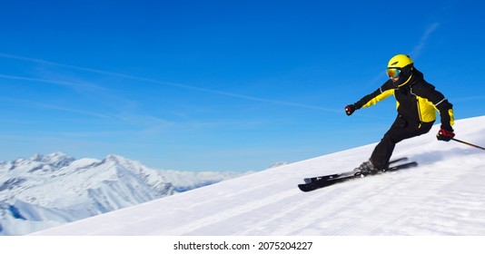 Professional Alpine Skier Skiing Downhill In High Mountains Of Alps