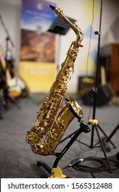 Professional alto Saxophone on the stand on scene after (before) the concert or repetition - Shutterstock ID 1565312488