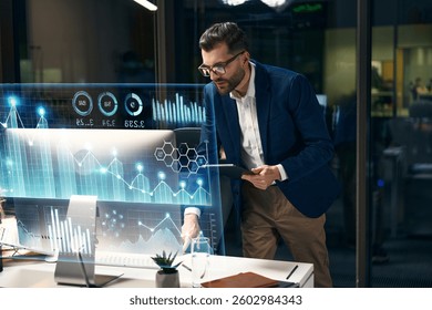 Professional Analyst Assessing Digital Data Visualizations On Modern Office Screens