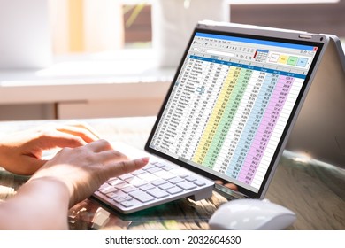 Professional Analyst Employee Using Spreadsheet Data On Laptop Computer