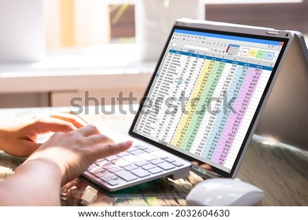 Professional Analyst Employee Using Spreadsheet Data On Laptop Computer