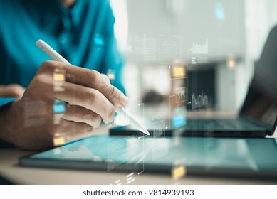 Professional analyzing big data dashboards on a tablet with digital charts and AI insights for smarter business decisions and analytics.