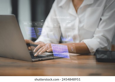 Professional analyzing complex data with a futuristic holographic display interface over a laptop, demonstrating cutting-edge technology in business analytics - Powered by Shutterstock