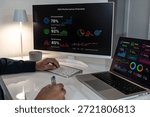 Professional analyzing ESG performance overview on dual screens, meticulously monitoring environmental, social, and governance metrics