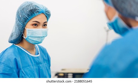Professional anesthesiologist doctor medical team and assistant preparing patient to gynecological surgery performing operating with surgery equipment in modern hospital operation emergency room - Shutterstock ID 2188051645