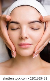 Professional anti-aging facial massage. Action. Relaxing facial treatment at Spa. Relaxing and rejuvenating facial massage for women - Shutterstock ID 2201685461