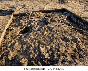 professional archaeological excavation in progress. sharp, clean edges and geometric patterns soil aren't accidental systematic method used to reveal history hidden beneath surface. Wheeler-Kenyon Method​grid structure checkered archaeological. By leaving walls of earth—known as baulks between excavated squares, basket. findings