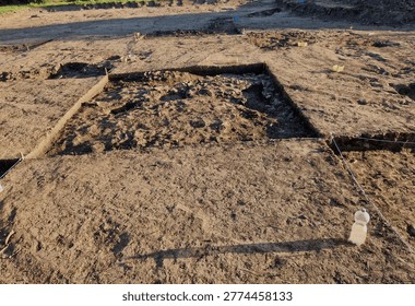 professional archaeological excavation in progress. sharp, clean edges and geometric patterns soil aren't accidental systematic method used to reveal history hidden beneath surface. Wheeler-Kenyon Method​grid structure checkered archaeological. By leaving walls of earth—known as baulks between excavated squares, basket. findings