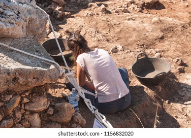 Professional archaeologist is digging in search of historical finds in Spain