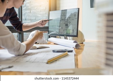 professional architect designer structural engineer team colleagues working office looking computer discussing building plan design project  - Shutterstock ID 1145372444