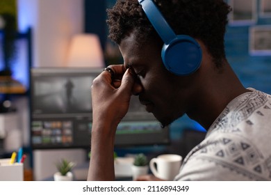 Professional artist editor working at movie montage creating graphic effects on computer using post production software in creativity studio. Agency creator editing film footage. Remote work