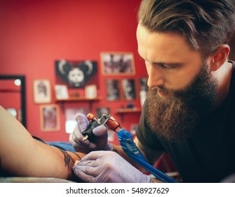 Professional Artist Making Tattoo In Salon, Close Up View